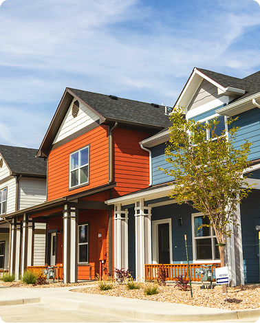 Modern mixed-use building and residential units above.
