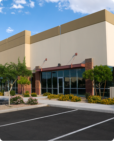 Newly constructed retail plaza with glass storefronts, brick accents, and metal awnings, ready for tenant occupancy.