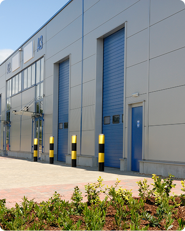 View of the outside of a large warehouse.